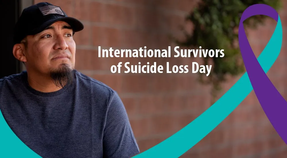 Article image for International Survivors of Suicide Loss Day, a teal and purple ribbon beside a Veteran.