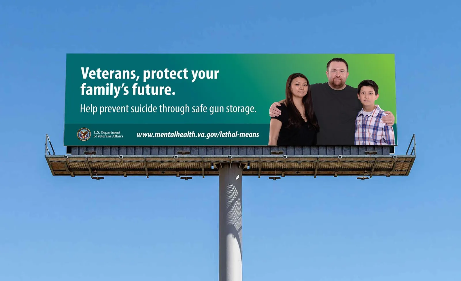 A roadside billboard: “Veterans, protect your family's future. Help prevent suicide through safe gun storage.”