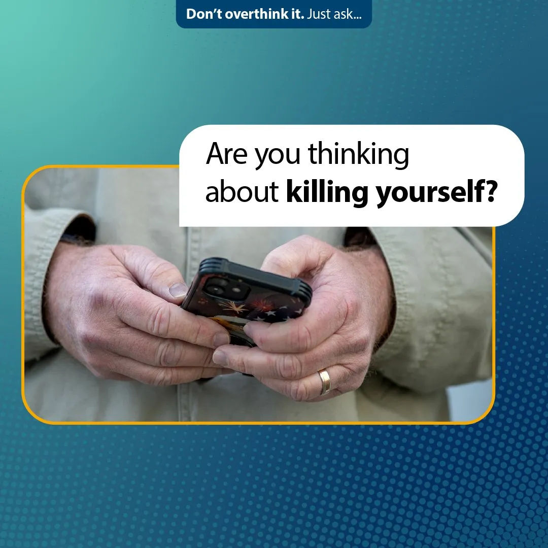 Social graphic over hands holding a phone: “Are you thinking about killing yourself?”