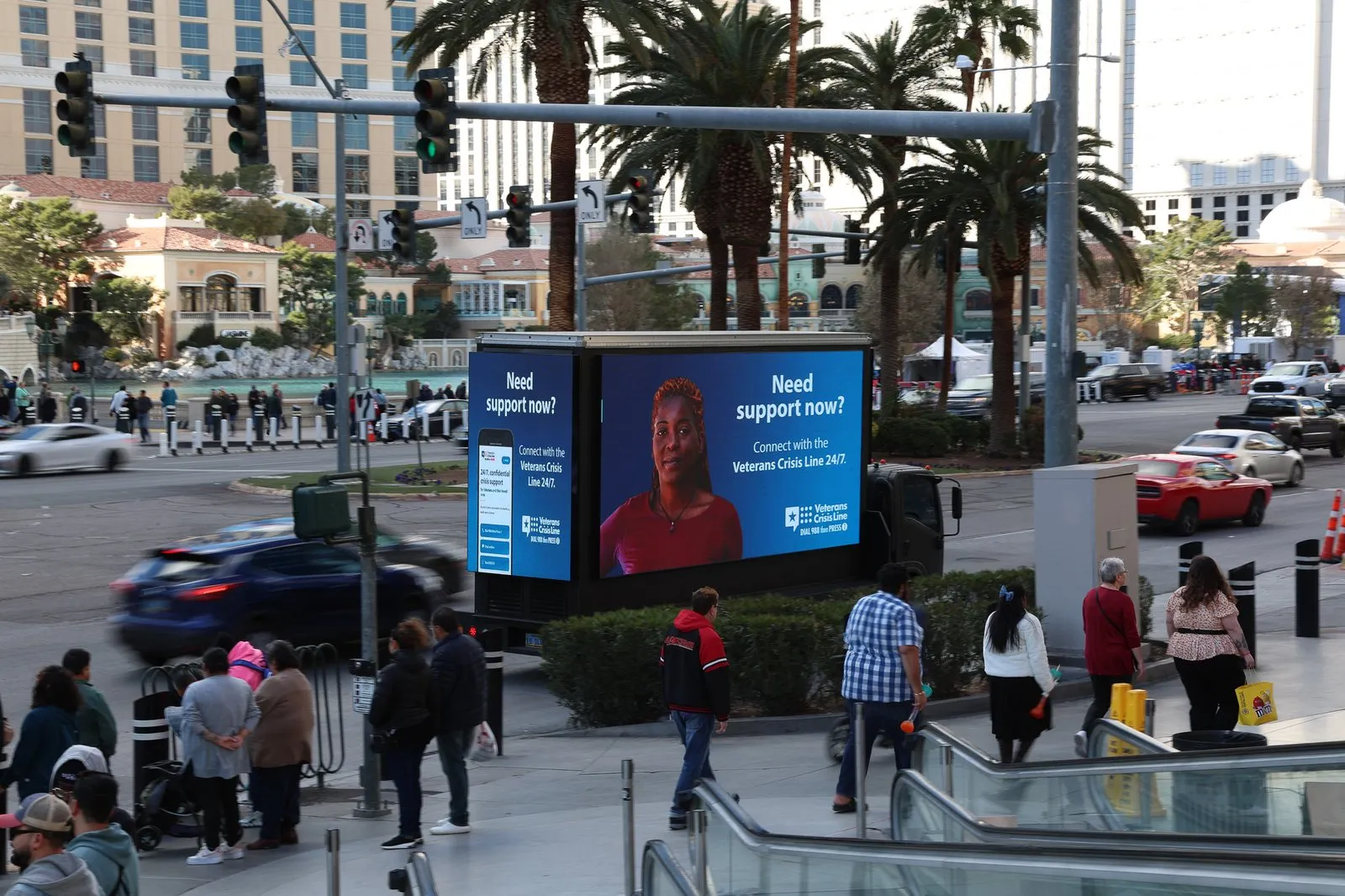 A second Las Vegas street placement from the same week, the “Need support now?” board beside a crosswalk.