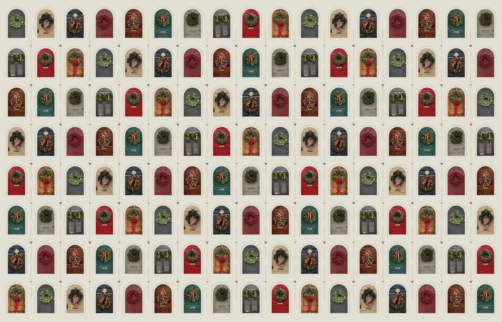 Wrapping paper pattern of arched front doors, each hung with a different holiday wreath, repeating in rows on a pale ground.